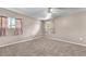 Large bedroom with neutral carpeting and window coverings at 5820 Sheila Ave, Las Vegas, NV 89108