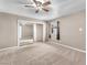 Bedroom with mirrored closet doors and neutral wall colors at 5820 Sheila Ave, Las Vegas, NV 89108