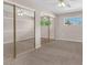 Spacious bedroom with mirrored closet doors and neutral carpeting at 5820 Sheila Ave, Las Vegas, NV 89108