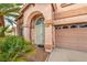 Front entry of the house with decorative iron doors and tile flooring at 2728 Aspen Wood Ave, Henderson, NV 89074