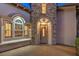 Elegant front door with stone surround and arched entryway at 200 Villa Borghese St, Las Vegas, NV 89138