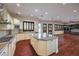 Open kitchen with large island, granite countertops, and hardwood floors at 200 Villa Borghese St, Las Vegas, NV 89138