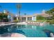 Inviting pool and spa with spacious patio and lush landscaping at 8130 Cassian Ct, Las Vegas, NV 89129