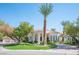 Luxury home with circular driveway and manicured landscaping at 8130 Cassian Ct, Las Vegas, NV 89129