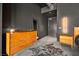 Mid-century modern bedroom with dresser and cowhide rug at 200 Hoover Ave # 1502, Las Vegas, NV 89101