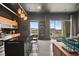 Modern kitchen with island, wood cabinets and city views at 200 Hoover Ave # 1502, Las Vegas, NV 89101