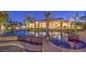 Luxury pool and spa with palm trees and landscape lighting at 2780 El Camino Rd, Las Vegas, NV 89146