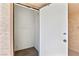 Small storage room with white door and carpeted floor at 3827 Desert Marina Dr # 211, Laughlin, NV 89029