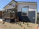 Single-wide manufactured home with a covered porch and desert landscaping at 380 Hilton Head St, Pahrump, NV 89048