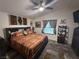 King-size bed with southwestern bedding and ceiling fan at 380 Hilton Head St, Pahrump, NV 89048