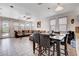 Open dining area with seating for six and views into living room and kitchen at 4129 Fabulous Finches Ave, North Las Vegas, NV 89084