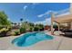 Inviting kidney-shaped pool with ample deck space at 4129 Fabulous Finches Ave, North Las Vegas, NV 89084