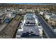 Aerial view of a neighborhood featuring multiple modern homes with solar panels at 10736 Patina Hills Ct, Las Vegas, NV 89135