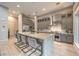 Modern kitchen with large island and stainless steel appliances at 10736 Patina Hills Ct, Las Vegas, NV 89135