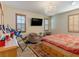 Main bedroom with a large bed, two armchairs, and a chandelier at 9096 Becket Ranch Ct, Las Vegas, NV 89113