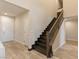 Elegant staircase with dark wood and wrought iron at 9096 Becket Ranch Ct, Las Vegas, NV 89113