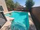 Relaxing backyard pool and spa with a spacious patio at 1701 April Shower Pl, Las Vegas, NV 89144