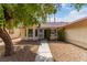 Single story home with mature trees and walkway at 4323 Veranda Hill Ct, North Las Vegas, NV 89031