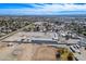 Aerial view showing large equestrian property with a vast arena at 5820 W La Madre Way, Las Vegas, NV 89130