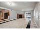 Living room with marble floors, fireplace and access to patio at 5820 W La Madre Way, Las Vegas, NV 89130