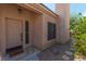 Tan front door with sidelights and a welcome mat in front at 1214 Country Club Dr, Laughlin, NV 89029