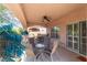 Covered patio with seating area, ceiling fan, and access to backyard at 1214 Country Club Dr, Laughlin, NV 89029