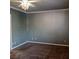 Spacious carpeted bedroom with neutral walls and ceiling fan at 2179 Tiger Willow Dr, Henderson, NV 89012