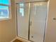 Clean shower with glass enclosure and white subway tile at 740 Monroe Hill Pl, Henderson, NV 89011