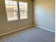 Spacious bedroom with neutral carpeting and large windows at 740 Monroe Hill Pl, Henderson, NV 89011