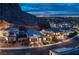 Luxury community nestled in the hills at night, aerial view at 1917 Regal Bluff Dr, Henderson, NV 89052