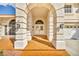 Elegant entryway with arched columns and double doors at 9208 November Breeze St, Las Vegas, NV 89123