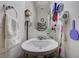 Small bathroom with a pedestal sink and a mirror at 8783 Halcon Ave, Las Vegas, NV 89148