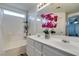 Bathroom with double vanity, shower, and bathtub at 925 Shining Rose Pl, Henderson, NV 89052