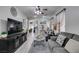 Spacious living room with gray sofas, coffee table, and hardwood floors at 925 Shining Rose Pl, Henderson, NV 89052