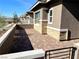 A paved patio with a gate and stone wall at 76 Ella Ashman Ave, Henderson, NV 89011