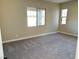 Spacious bedroom with neutral carpeting and large windows at 80 Ella Ashman Ave, Henderson, NV 89011