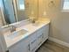 Double vanity bathroom with white cabinets and quartz countertops at 84 Ella Ashman Ave, Henderson, NV 89011