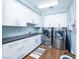 Bright laundry room with modern washer and dryer set at 9219 Tesoras Dr # 402, Las Vegas, NV 89144