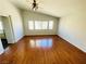 Large living room with hardwood floors and ceiling fan at 5285 Toro Creek Ct, North Las Vegas, NV 89031