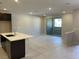 Open living space with tile floors and access to a patio at 11414 Ethereal Landing Ave, Las Vegas, NV 89138