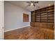 Bright library featuring built-in bookshelves and hardwood floors at 7421 Silver Palm Ave, Las Vegas, NV 89117