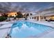 Beautiful pool and spa at sunset at 7421 Silver Palm Ave, Las Vegas, NV 89117