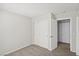 Bedroom with double door closet and access to another room at 4805 Principle Ct, North Las Vegas, NV 89031