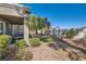 Covered patio with seating area and mature trees at 8628 Desert Holly Dr # 0, Las Vegas, NV 89134