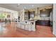 Modern kitchen featuring dark cabinetry, stainless steel appliances, and a breakfast bar at 6 Lago Turchino Ct, Henderson, NV 89011