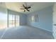 Spacious bedroom with balcony access, carpet floors, and a ceiling fan at 3550 Bay Sands Dr # 2079, Laughlin, NV 89029