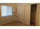 Bright bedroom with tiled floor, double closet, and small vanity at 3423 Chedworth Rd, North Las Vegas, NV 89031