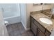 Clean bathroom with granite countertop vanity and tiled floor at 3717 Iverson Ln, North Las Vegas, NV 89032