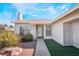 Inviting front entry with a walkway, landscaping, and security bars on the windows at 7373 Newcrest Cir, Las Vegas, NV 89147