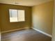 Simple bedroom with a window and wood-look floors at 5008 Frozen Springs Ct, Las Vegas, NV 89130